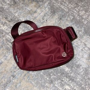 New without tags everywhere belt bag in red merlot